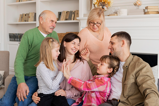 Nuclear Family and granparents gathered in a group.