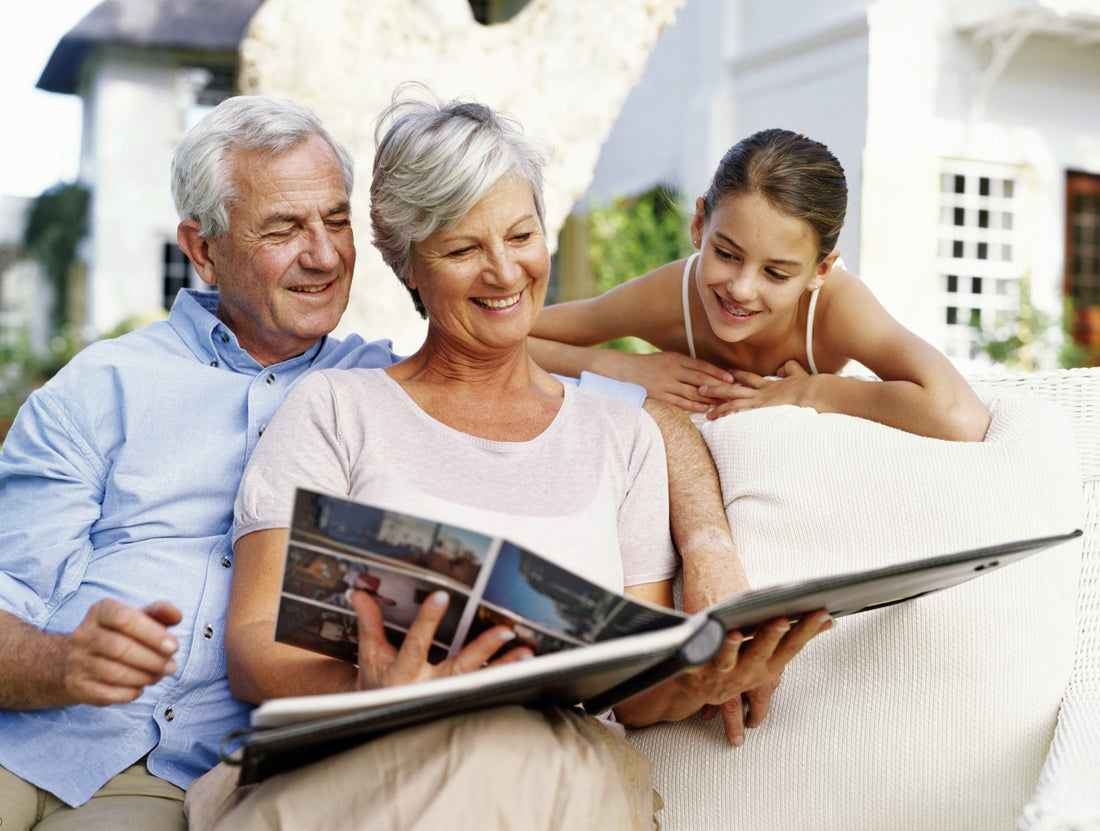 Grandparents showing granchild old photos