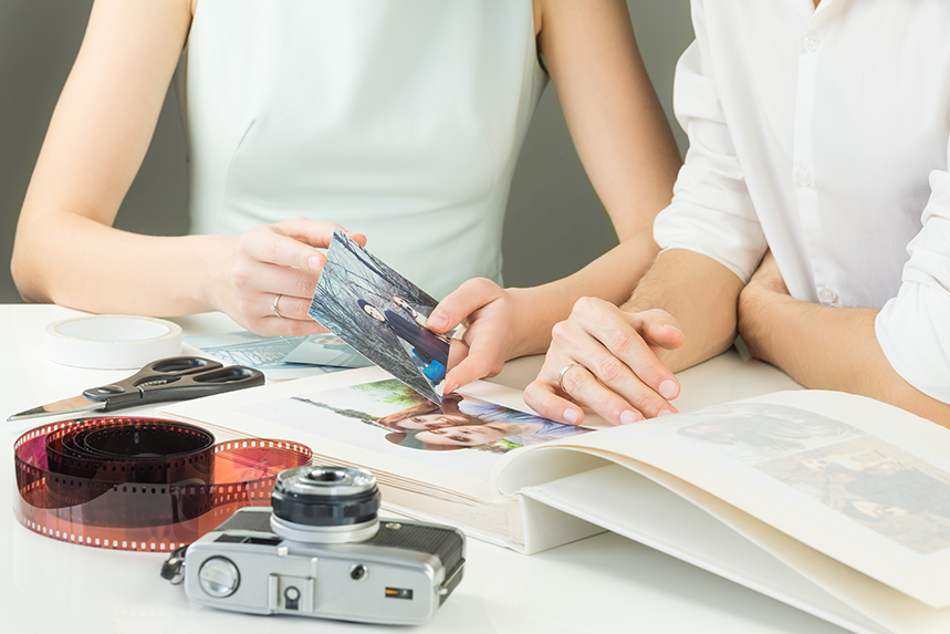 Two women discussing photo to scrapbook